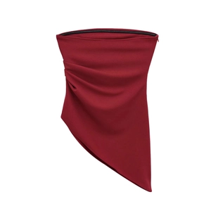 Detail view of burgundy asymmetric top with ruched texture and sharp pointed hem design