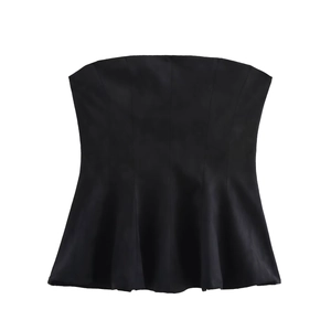 Detail of matte black peplum tube top with elegant ruffled hemline and woven texture