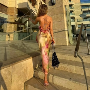 Elegant backless floral satin maxi dress with crisscross straps and open back detail
