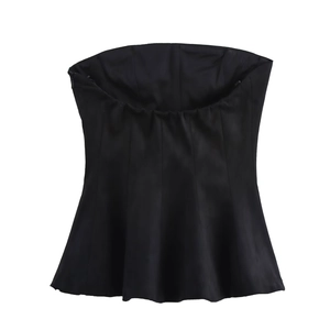 Detail of black strapless corset top with structured seams and flared peplum hem