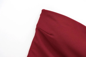 Macro shot of dark red textured fabric with professional stitching and fine weaving detail