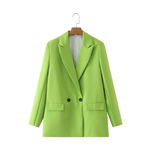 Close-up of lime green double-breasted blazer with peaked lapels and dark buttons