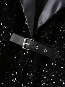 Detail of sequin blazer with black faux leather lapels and silver buckle belt