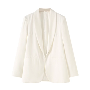 Detail of white shawl lapel blazer with minimalist pocket design and sleek slim fit
