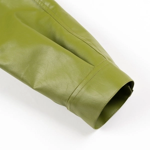 Detailed close-up showing fine stitching on green leather jacket sleeve cuff