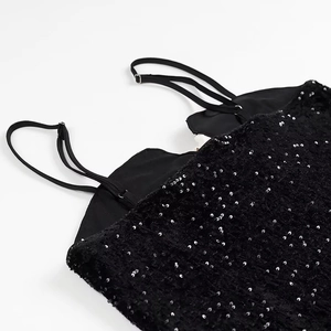 Elegant black sequin dress featuring adjustable thin straps and shimmering embroidery