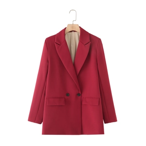 Close-up of wine red double-breasted blazer showing lapels and black buttons detail