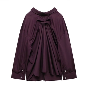 Detail view of stylish deep purple long sleeve shirt showing unique pleated back design