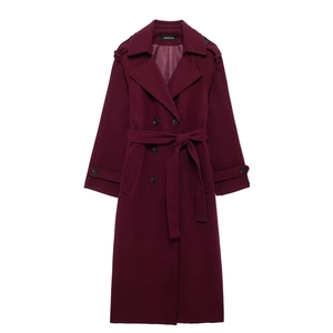 Detail of wine red double-breasted wool coat with notch lapels and waist belt tie