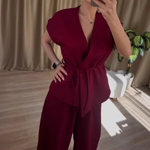 Women's burgundy sleeveless V-neck tie-waist top and high-waist wide-leg pants set