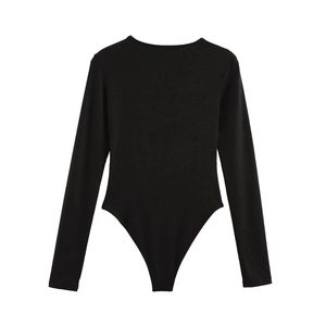 Detailed flat lay of black slim fit long sleeve bodysuit with crew neck and snap bottom