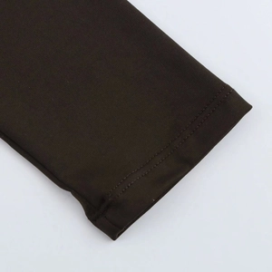 Close-up of double-needle stitching and high-density knit fabric in dark coffee brown