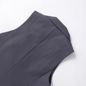 Back view of a charcoal grey sleeveless suit vest with detailed twill fabric and refined stitching