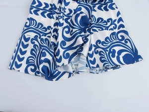 Detail view of the blue and white floral print fabric on the summer maxi dress