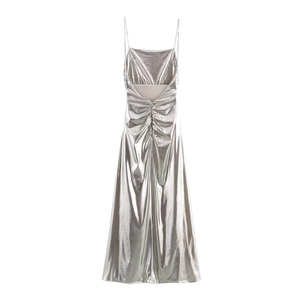Detail of silver metallic foil maxi dress showing back V-cut and pleated draping fabric
