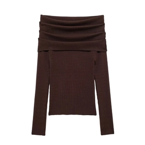 Close-up of chocolate brown off-the-shoulder knit top with ribbed texture and folded neckline