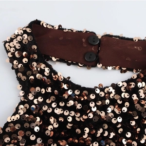 Halter neck sequin dress detail with rose gold sequins and black velvet fabric buttons