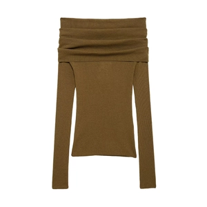 Detail of olive green ribbed knit texture on an elegant off-shoulder long sleeve top