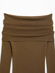 Detail of off-shoulder knit top featuring layered pleats and olive brown fabric texture