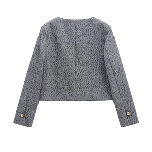 Women's cropped herringbone tweed jacket featuring gold button cuffs in a back view
