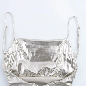 Fashionable silver metallic pleated camisole top with adjustable thin shoulder straps