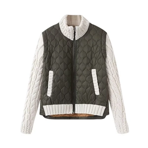 Women's olive green quilted jacket with white cable knit sleeves and stand collar
