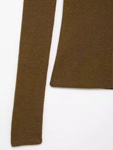 Detailed close-up of olive brown knitted fabric showing fine texture and stitching