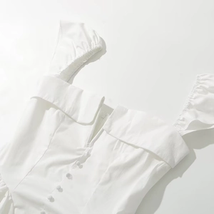 White V-neck pleated dress with puff sleeves and decorative buttons for a slim fit