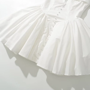 Elegant white V-neck pleated dress with button details and a cinched waist for women
