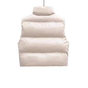 Women's cream puffer vest with horizontal quilting and a high collar for street style