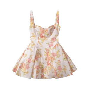 Detail of sweetheart neckline and vibrant floral print on mini cami summer dress