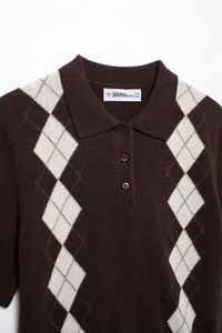 Detail of a brown argyle knit polo shirt showing the collar, buttons, and fabric texture