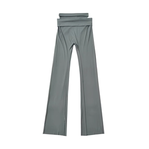 Sage green high-waisted flared trousers with cutout waist detail and elastic fit