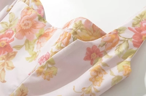 Close-up of floral print sundress with sweetheart neckline and wide shoulder straps