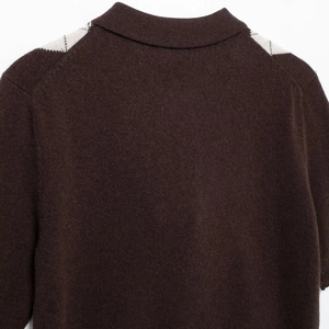 Women's dark coffee knit polo shirt with stylish argyle pattern on shoulders and collar