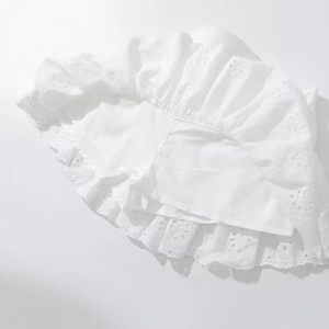 Women's white lace mini skort with floral eyelet embroidery and ruffle hem details