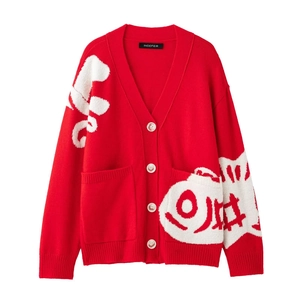 Detail of red V-neck knit cardigan showing white jacquard fish patterns and buttons