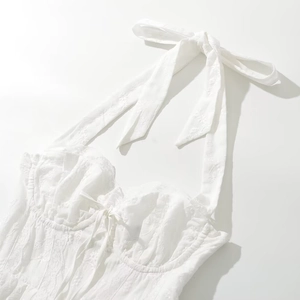 Elegant white lace halter corset top with floral embroidery and bow tie closure detail