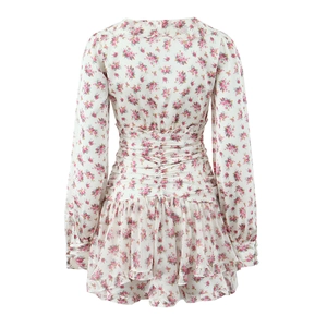 White floral long sleeve dress with ruffle hem and smocked waist for a bohemian look