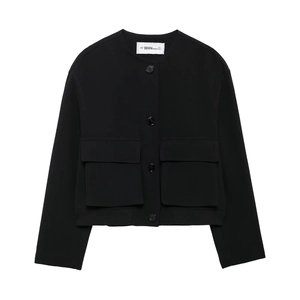 Detail shot of black cropped jacket featuring large flap pockets and ribbed hem finishing
