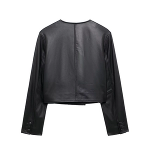 Close-up of the back view of a black faux leather jacket with sleeve button details