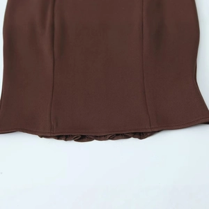 Brown strapless top with fine twill fabric texture and delicate ruffled layered hem