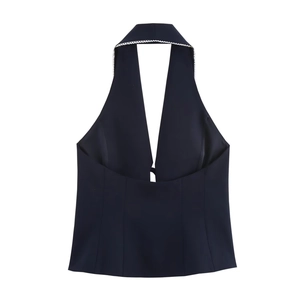 Detail of dark halter neck top with white lace trim and backless cut for women