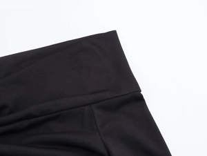 Close-up of black high-waisted knit waistband showing premium elastic fabric texture