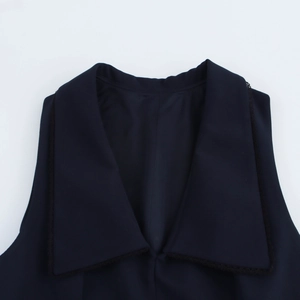 Short sleeveless waist dress with large lapel and black lace trim in solid dark blue