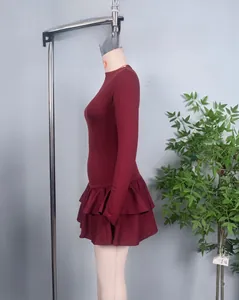 Detail view of burgundy slim fit long sleeve dress featuring layered ruffle hem decoration