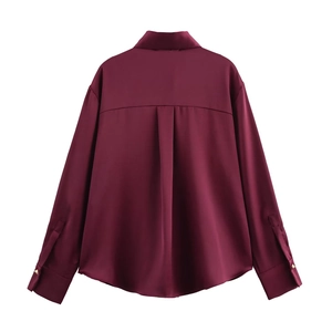 Elegant wine red satin long sleeve shirt featuring golden cuff buttons and back pleat detail