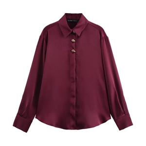 Elegant wine red satin shirt for women with metallic gold buttons and sleek silk texture