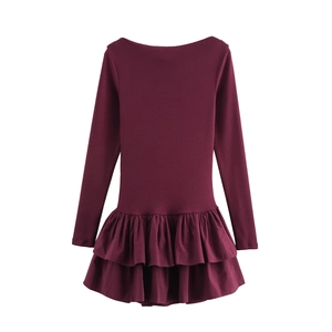 Detail view of the elegant deep red long sleeve dress featuring pleated ruffle hem design