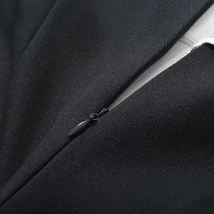 Sleeveless dress featuring a seamless concealed zipper and smooth woven fabric texture